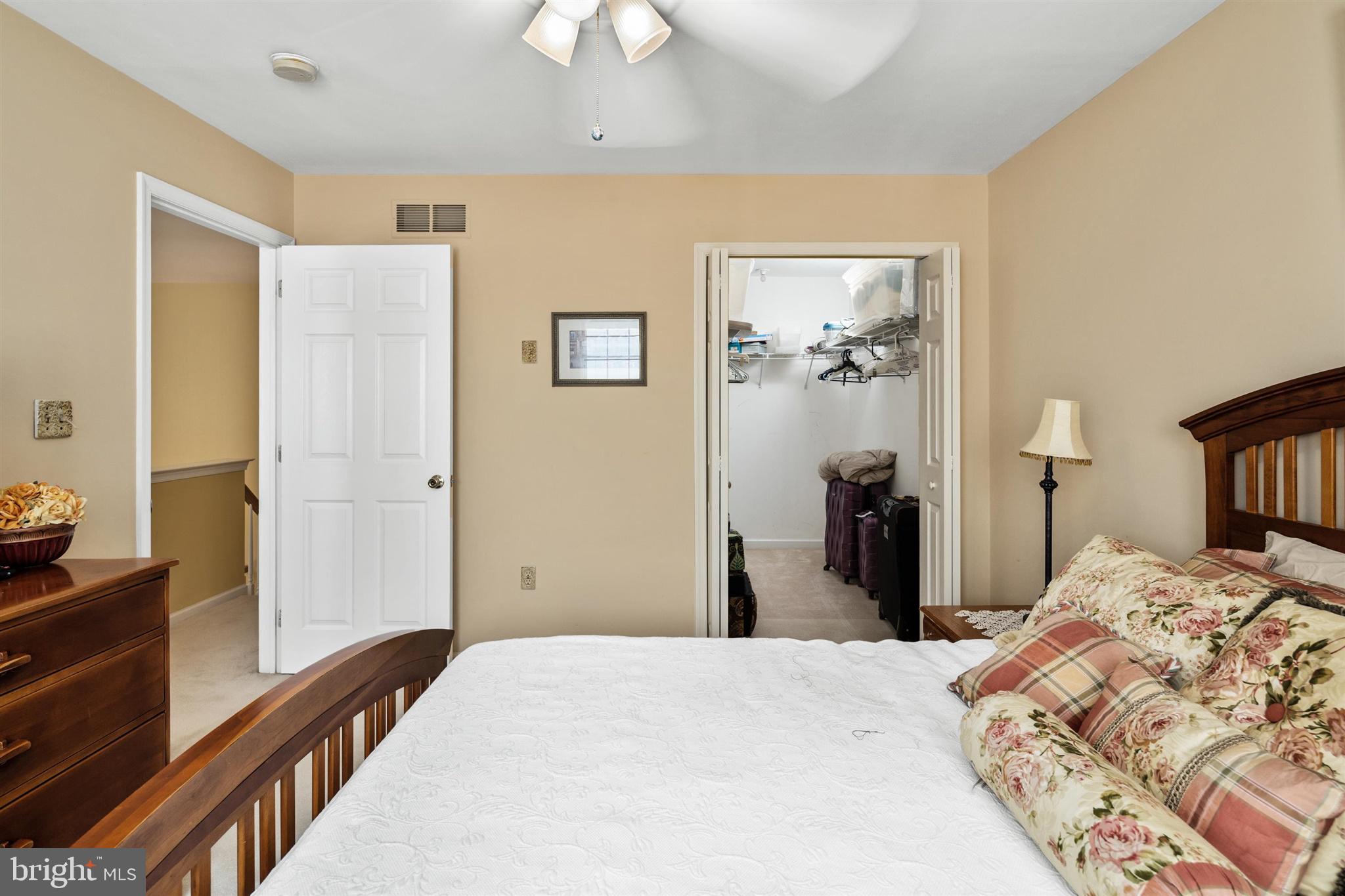 16 Winterberry Terrace Hamilton, NJ 08690 - Photo 22 of 26 a bedroom with a bed and a chandelier
