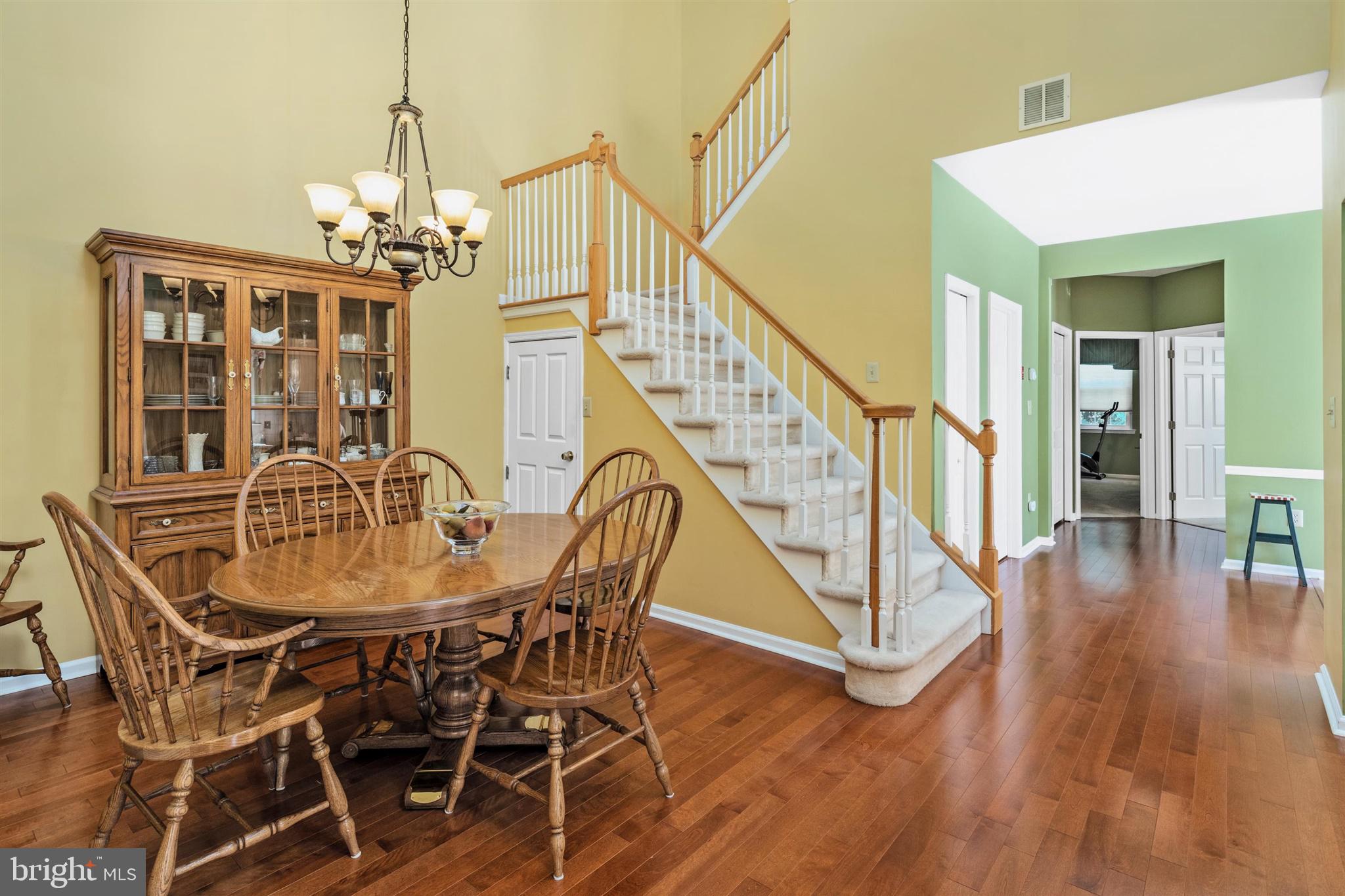 16 Winterberry Terrace Hamilton, NJ 08690 - Photo 5 of 26 a view of a dining room with furniture wooden floor and chandelier
