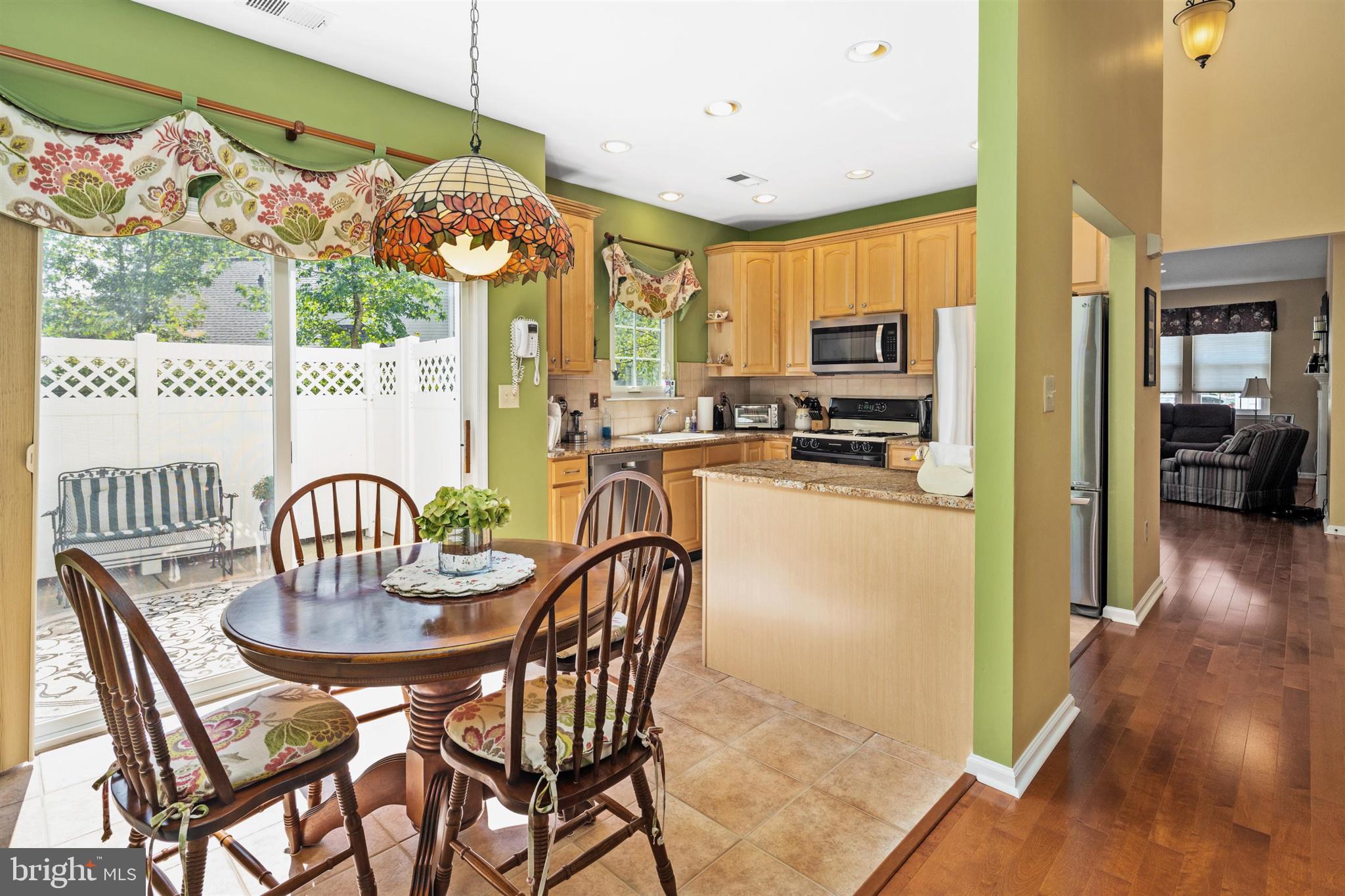 16 Winterberry Terrace Hamilton, NJ 08690 - Photo 8 of 26 a view of a dining room with furniture window and wooden floor