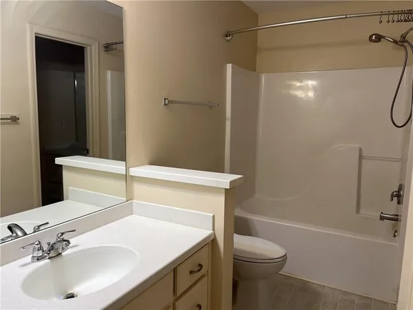 an empty room with closet area