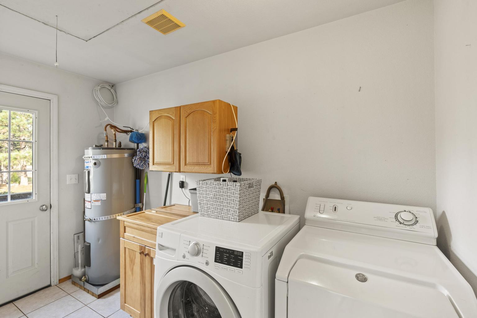 1190 Cedar Flat Road Williams, OR 97544 - Photo 22 of 45 a utility room with dryer and washer