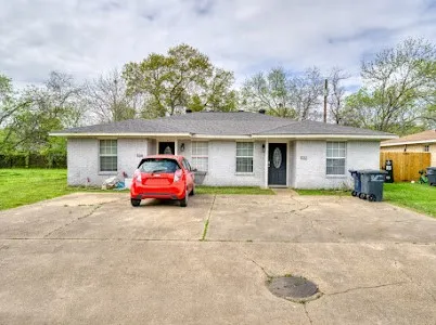 a car parked in front of a house