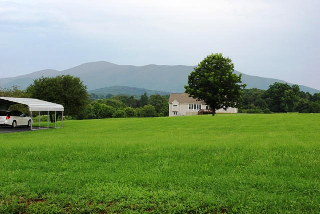 4501 Retreat Road Boones Mill, VA 24065 - Photo 2 of 57 a front view of a house with garden