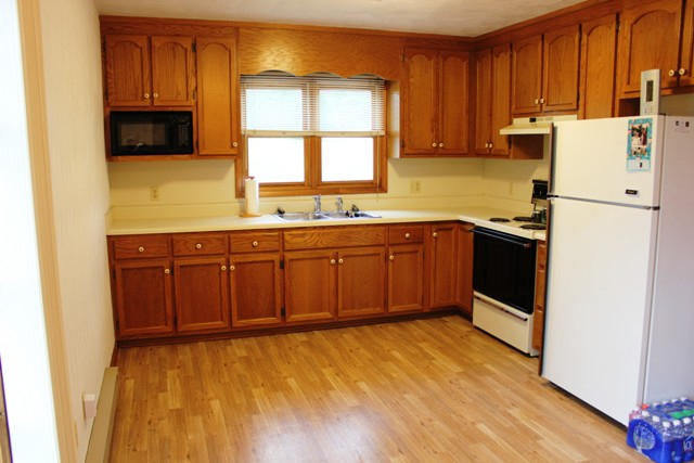 4501 Retreat Road Boones Mill, VA 24065 - Photo 12 of 57 a kitchen with stainless steel appliances granite countertop a sink stove and refrigerator