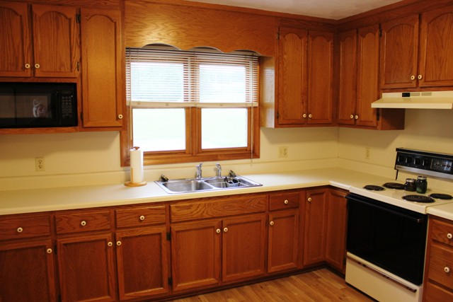4501 Retreat Road Boones Mill, VA 24065 - Photo 13 of 57 a kitchen with stainless steel appliances granite countertop wooden cabinets a sink and a window