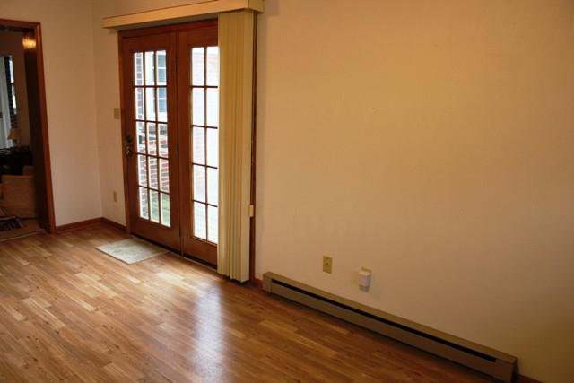 4501 Retreat Road Boones Mill, VA 24065 - Photo 14 of 57 an empty room with wooden floor and windows
