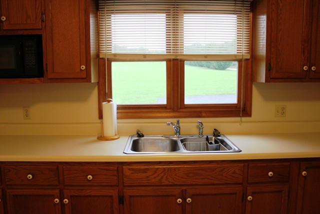 4501 Retreat Road Boones Mill, VA 24065 - Photo 15 of 57 a kitchen with a sink and a window