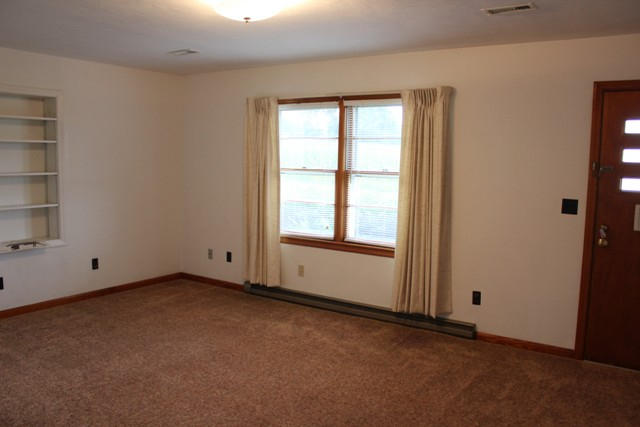 4501 Retreat Road Boones Mill, VA 24065 - Photo 17 of 57 an empty room with windows