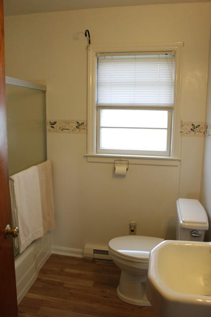 4501 Retreat Road Boones Mill, VA 24065 - Photo 29 of 57 a white toilet sitting next to a bathroom sink