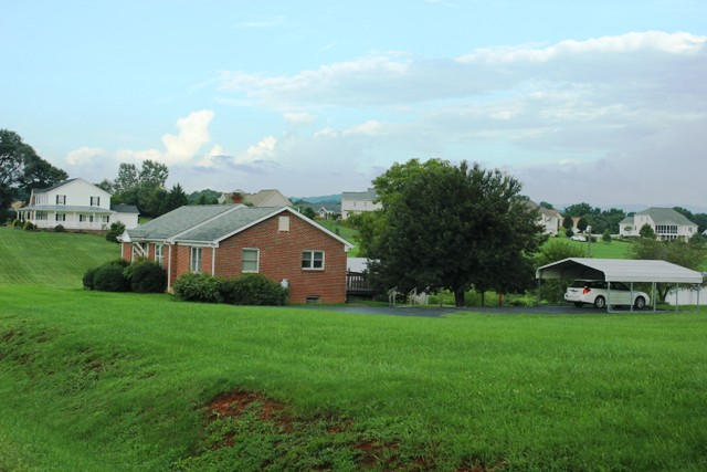 4501 Retreat Road Boones Mill, VA 24065 - Photo 55 of 57 a view of a house with a big yard and large trees