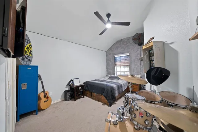 a room with a bed and a chandelier