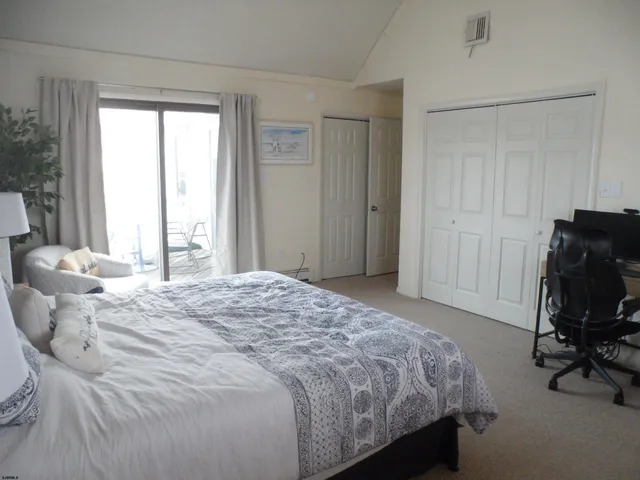 a view of a balcony with a table and chairs