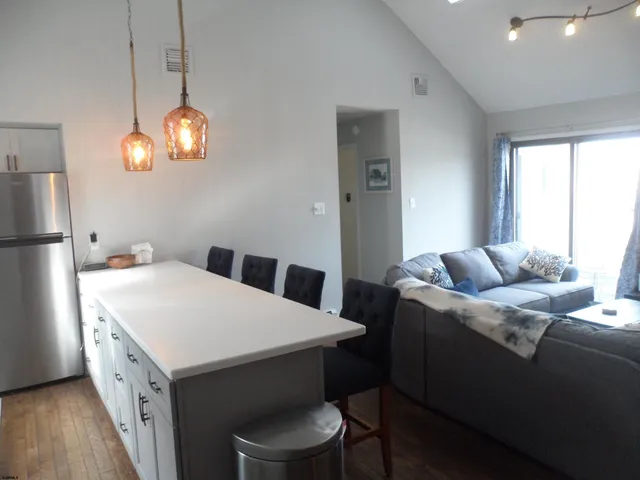 a very nice looking dining room with a large window