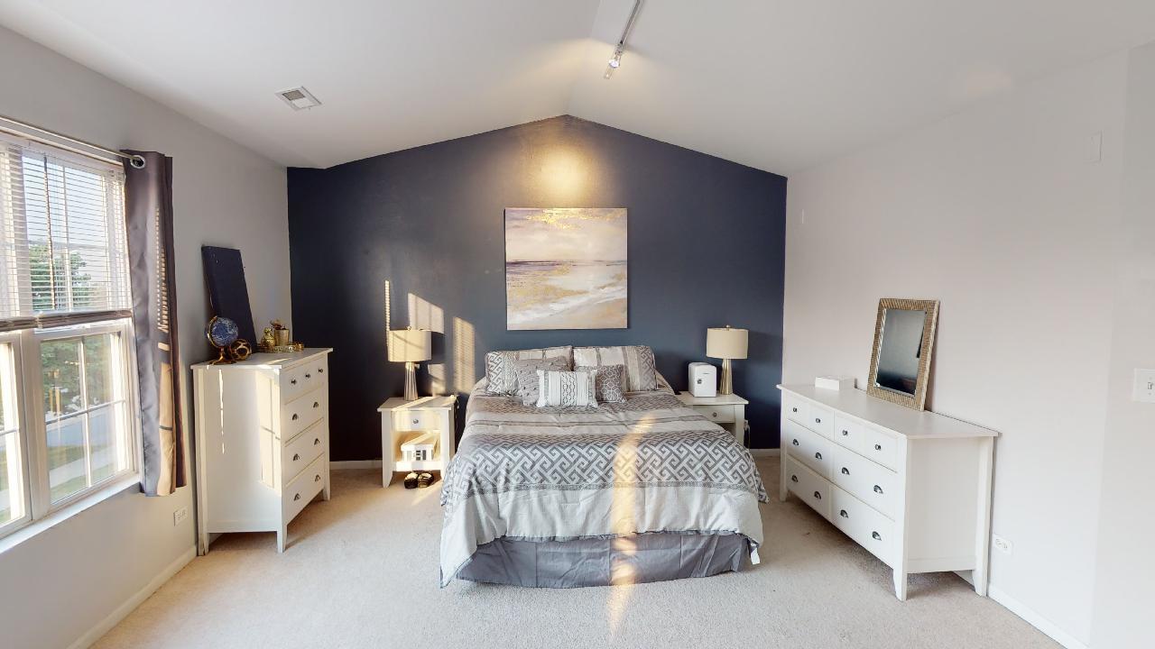 468 Butterfly Road Bolingbrook, IL 60490 - Photo 18 of 35 a bedroom with furniture and a large window
