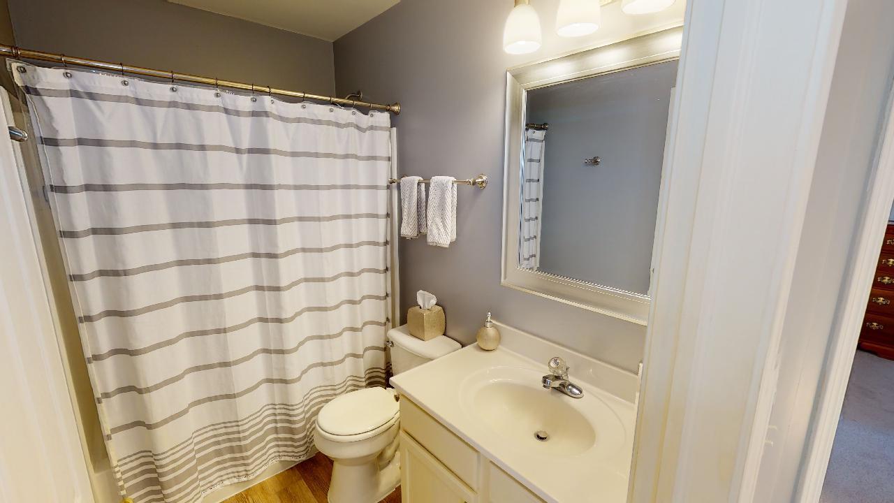 468 Butterfly Road Bolingbrook, IL 60490 - Photo 25 of 35 a bathroom with a sink toilet and shower