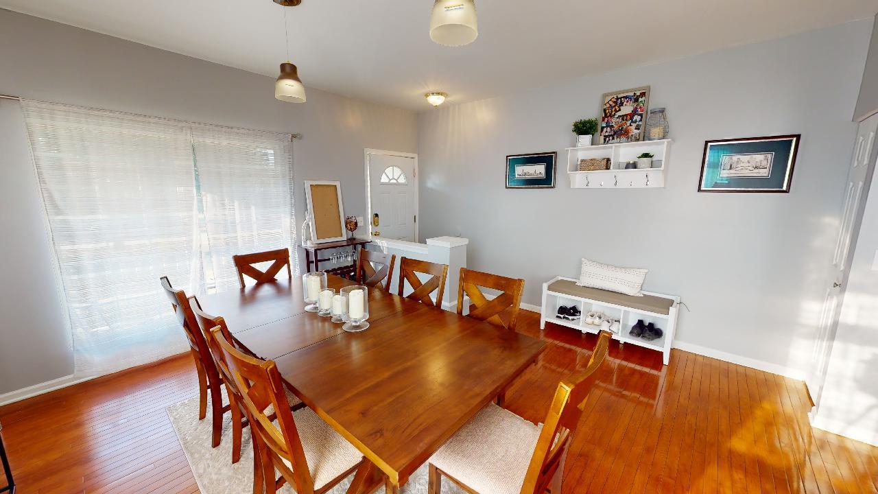 468 Butterfly Road Bolingbrook, IL 60490 - Photo 6 of 35 a dining room with furniture and wooden floor