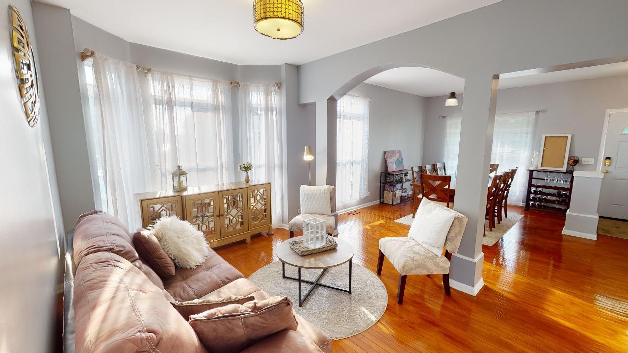 468 Butterfly Road Bolingbrook, IL 60490 - Photo 8 of 35 a living room with furniture and wooden floor