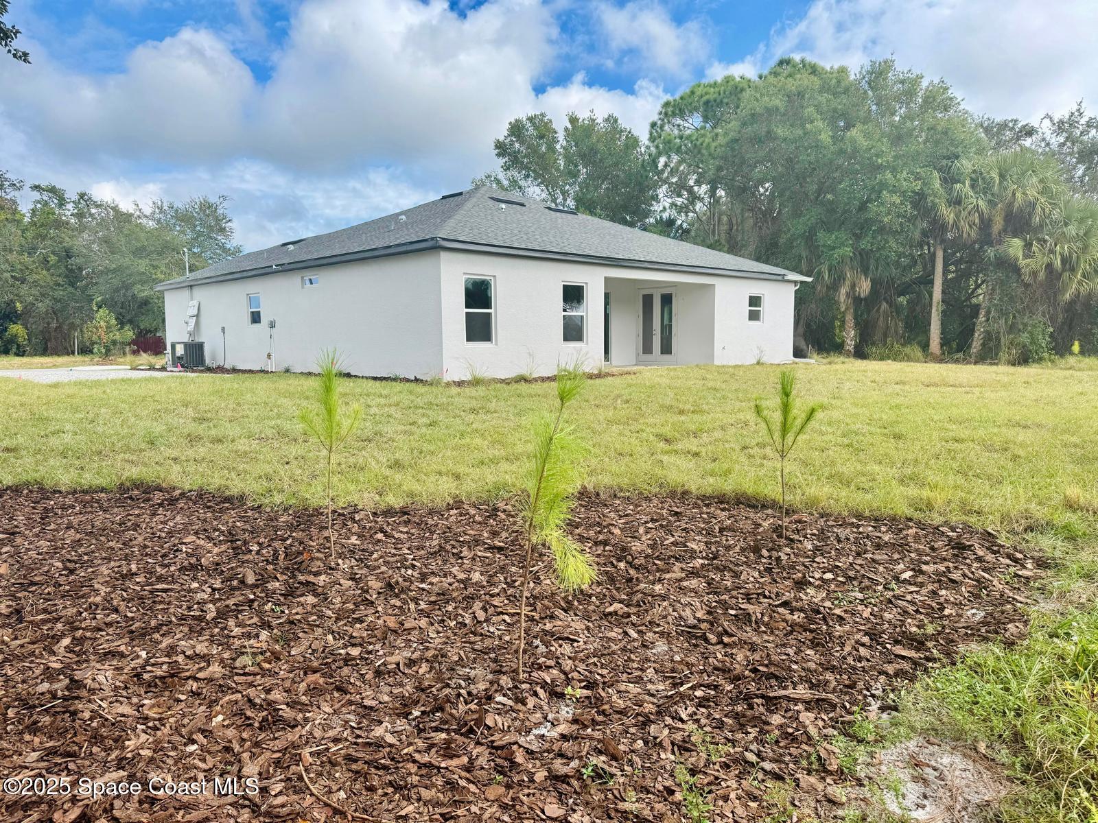 5915 Akers Street Cocoa, FL 32927 - Photo 11 of 33 a house view with a backyard space