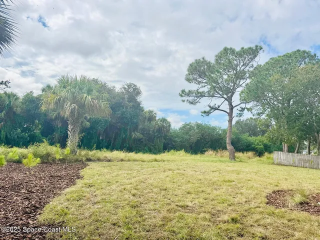 a view of swimming pool with a yard