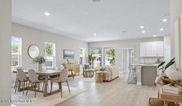 5915 Akers Street Cocoa, FL 32927 - Photo 19 of 33 a living room with fireplace furniture and a large window