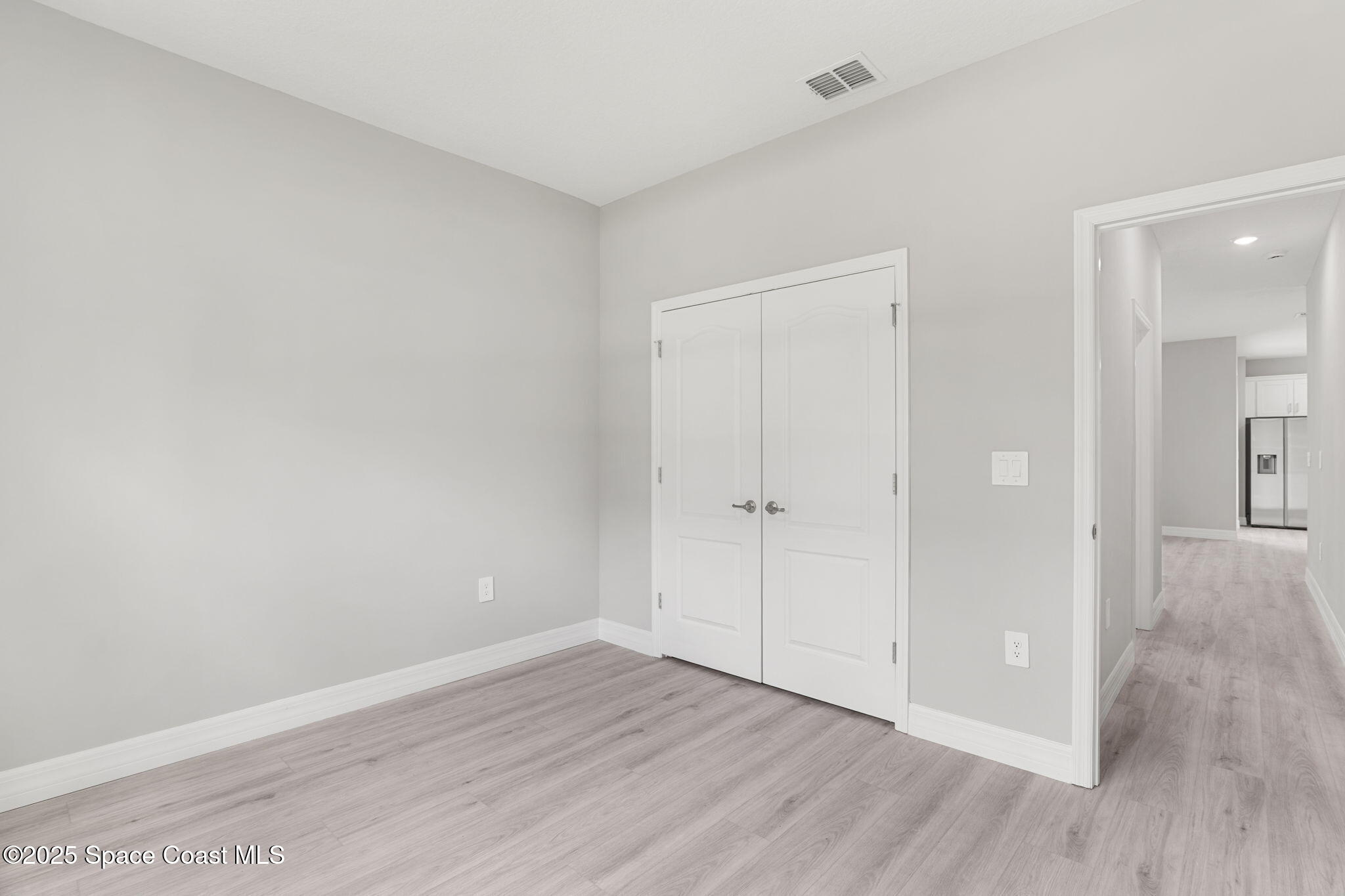 5915 Akers Street Cocoa, FL 32927 - Photo 23 of 33 a view of an empty room and wooden floor