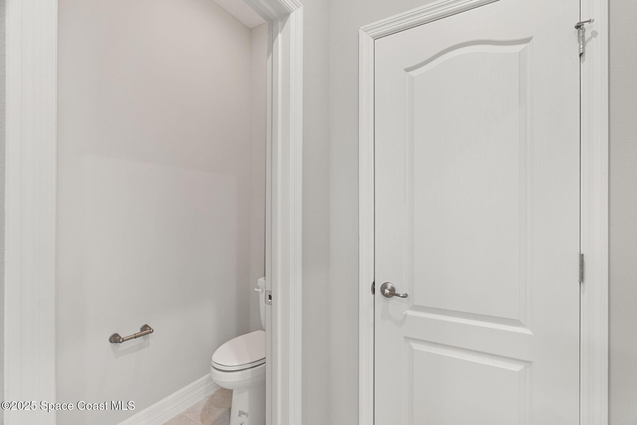 5915 Akers Street Cocoa, FL 32927 - Photo 30 of 33 a bathroom with a granite countertop toilet and a sink