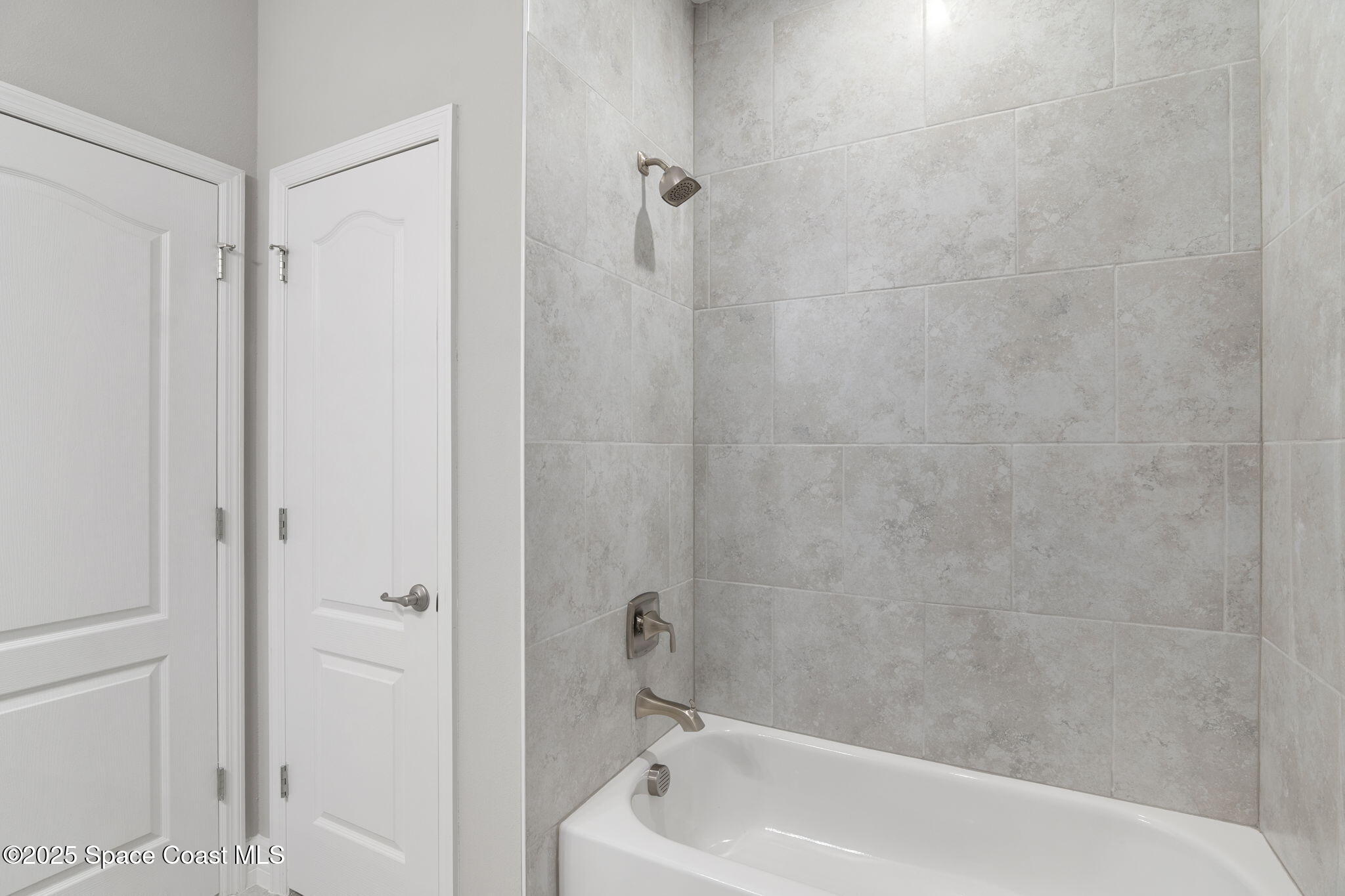 5915 Akers Street Cocoa, FL 32927 - Photo 31 of 33 a bathroom with a tub