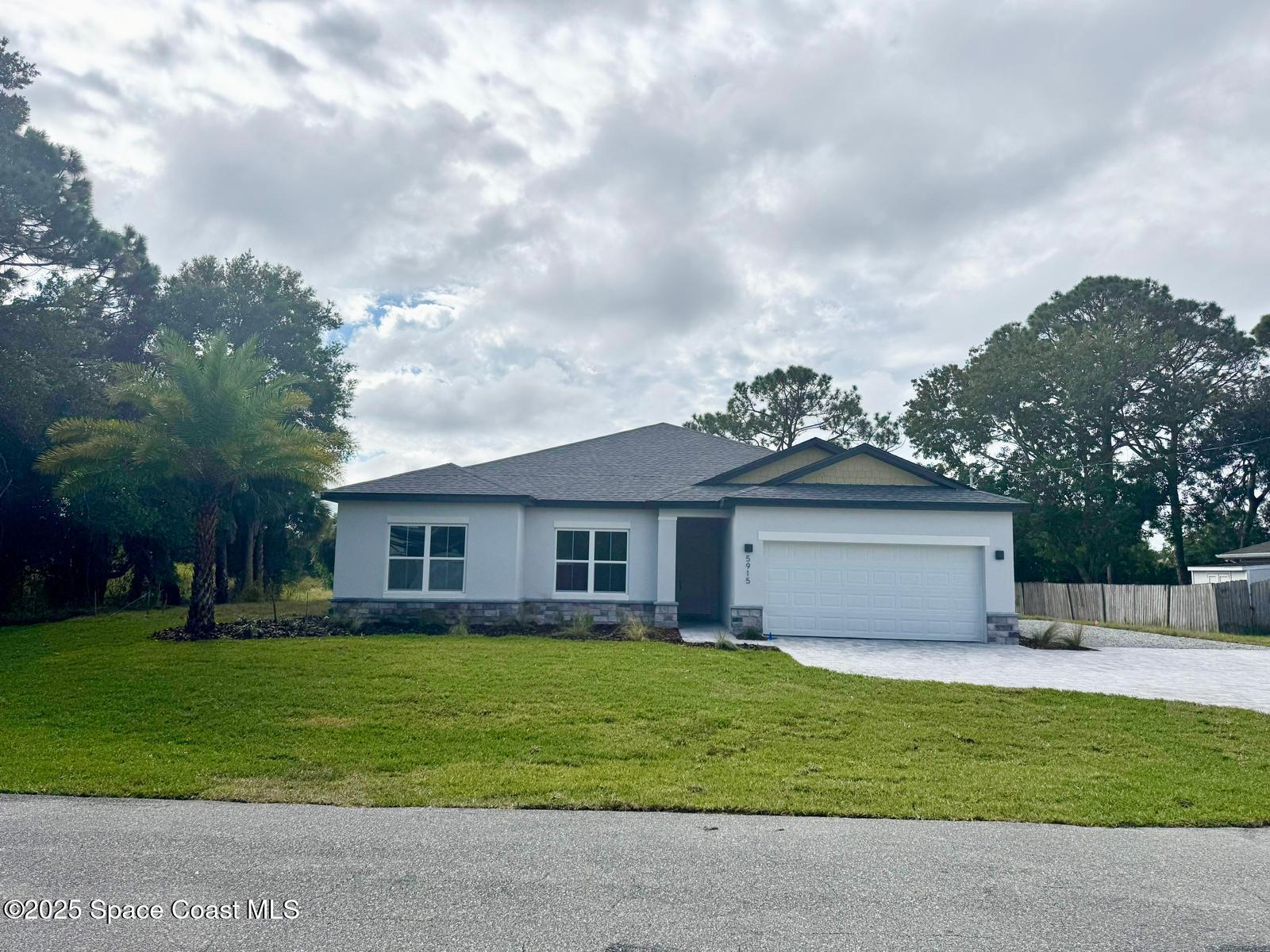 5915 Akers Street Cocoa, FL 32927 - Photo 8 of 33 a front view of house with yard and green space