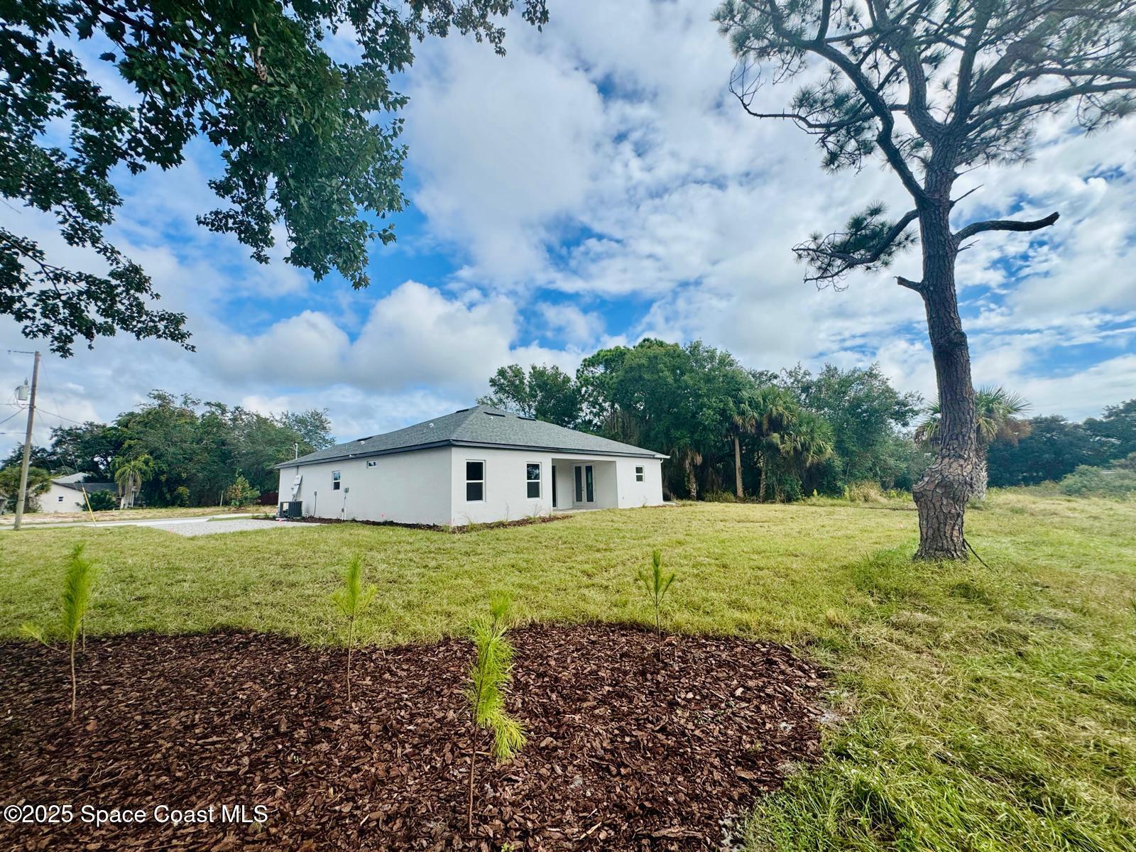 5915 Akers Street Cocoa, FL 32927 - Photo 10 of 33 a house view with trees in the background