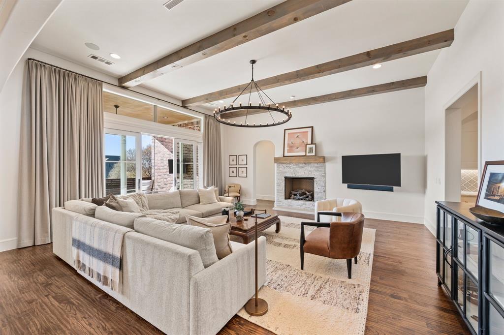 909 Winding Ridge Trail Southlake, TX 76092 - Photo 11 of 36 a living room with fireplace furniture and a flat screen tv