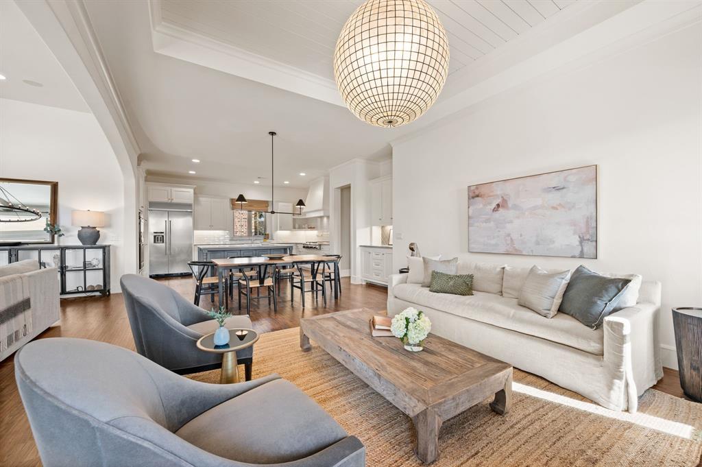 909 Winding Ridge Trail Southlake, TX 76092 - Photo 18 of 36 a living room with furniture and a chandelier