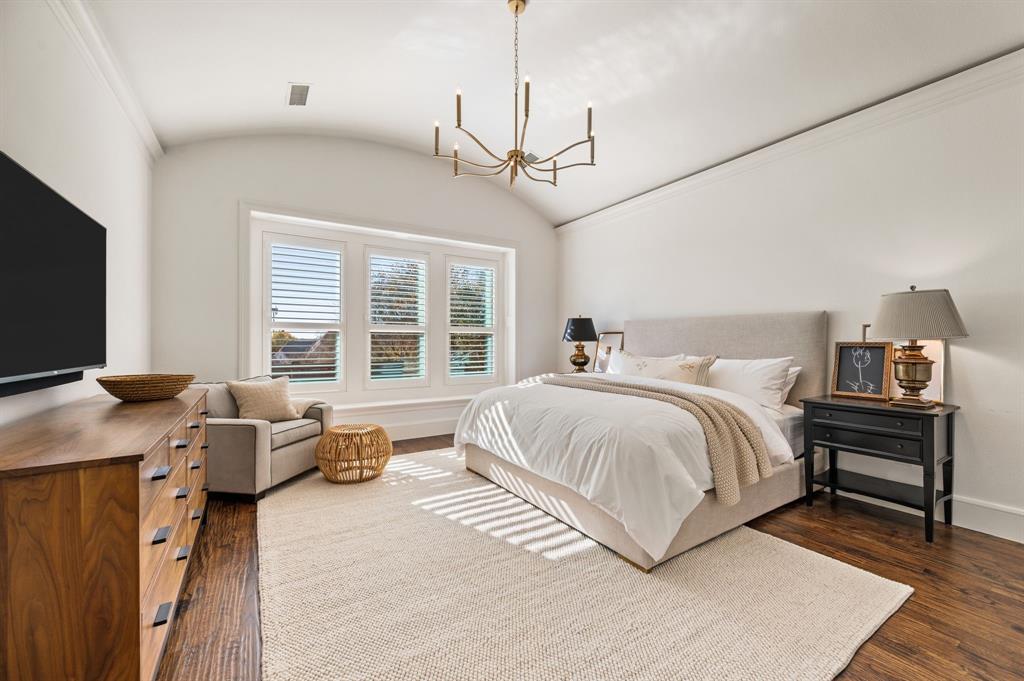 909 Winding Ridge Trail Southlake, TX 76092 - Photo 19 of 36 a bedroom with a bed and a flat screen tv