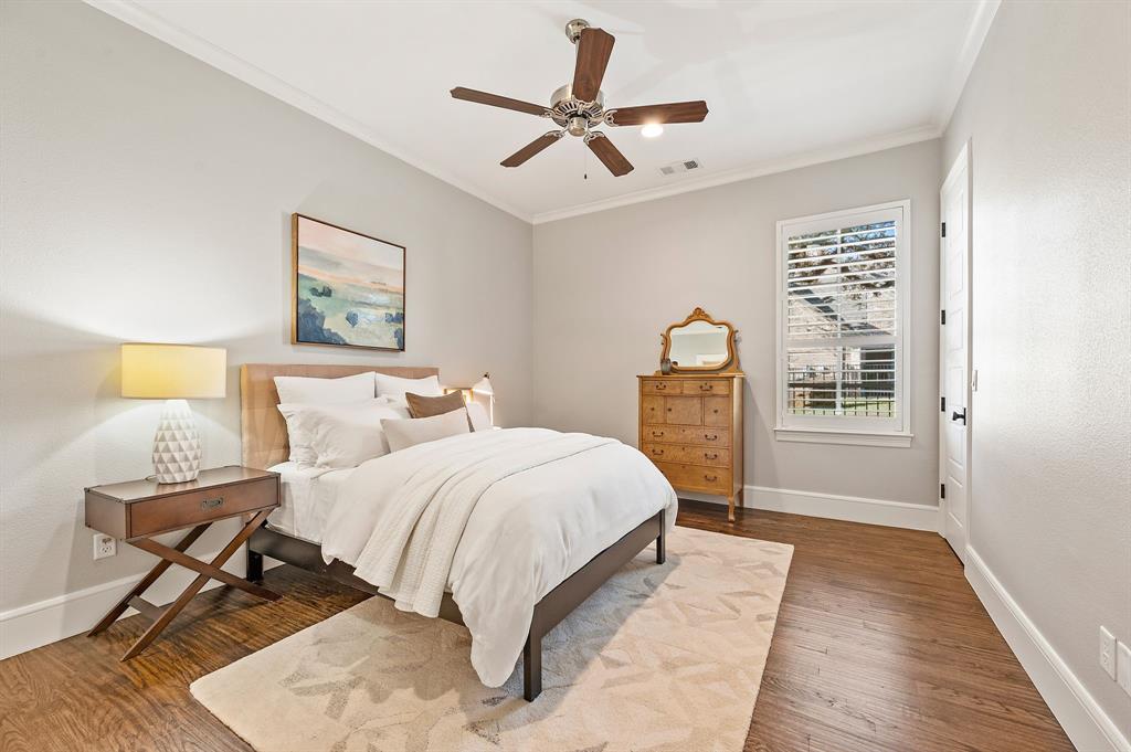 909 Winding Ridge Trail Southlake, TX 76092 - Photo 22 of 36 a bedroom with a bed a mirror and a window