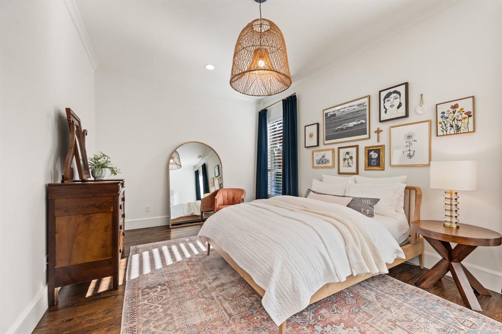 909 Winding Ridge Trail Southlake, TX 76092 - Photo 23 of 36 a bedroom with a bed and a chandelier