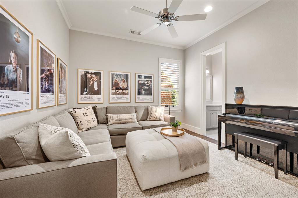 909 Winding Ridge Trail Southlake, TX 76092 - Photo 24 of 36 a spacious bedroom with a bed a couch and a chandelier