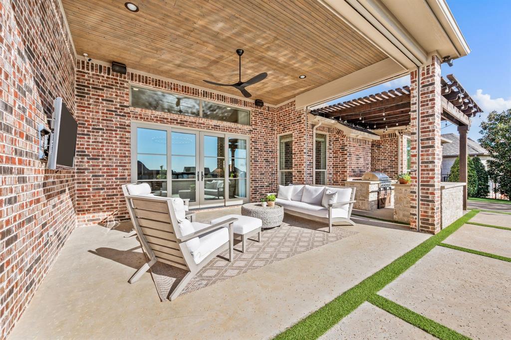 909 Winding Ridge Trail Southlake, TX 76092 - Photo 27 of 36 a building outdoor space with patio furniture and potted plants