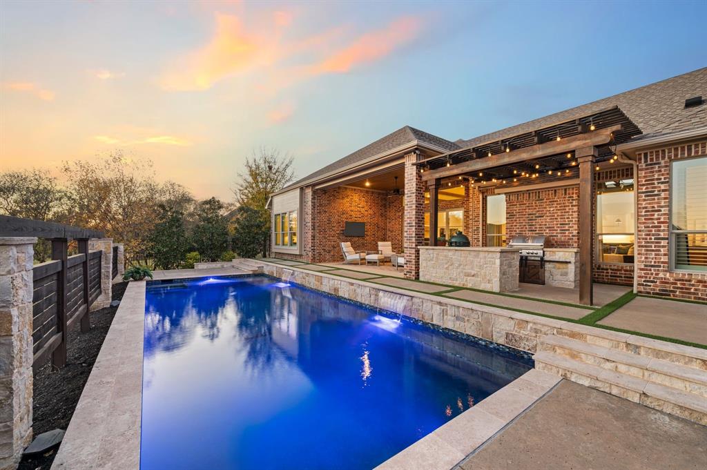909 Winding Ridge Trail Southlake, TX 76092 - Photo 30 of 36 a swimming pool with outdoor seating and yard