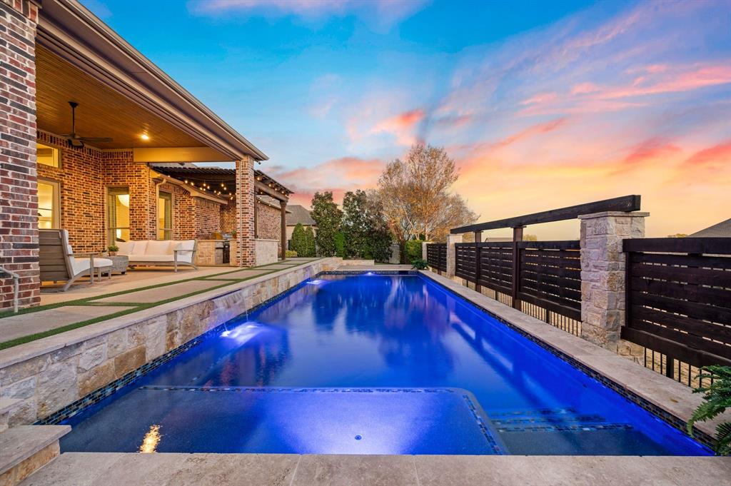 909 Winding Ridge Trail Southlake, TX 76092 - Photo 3 of 36 a view of swimming pool with outdoor seating