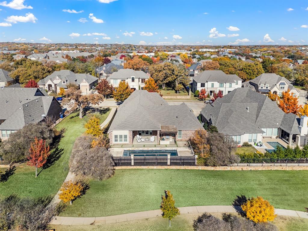 909 Winding Ridge Trail Southlake, TX 76092 - Photo 33 of 36 an aerial view of a house with a lake view