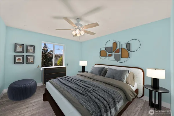 a bathroom with a granite countertop sink a toilet a mirror and shower