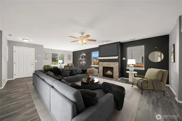 a living room with furniture and a fireplace