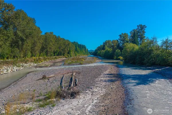 an aerial view of a house with a yard and a fountain