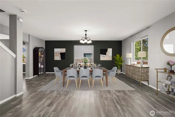 a view of a dining room with furniture and chandelier