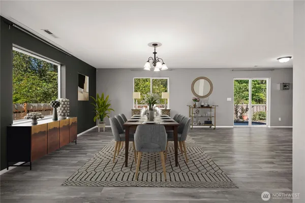 a view of a dining room with furniture window and wooden floor