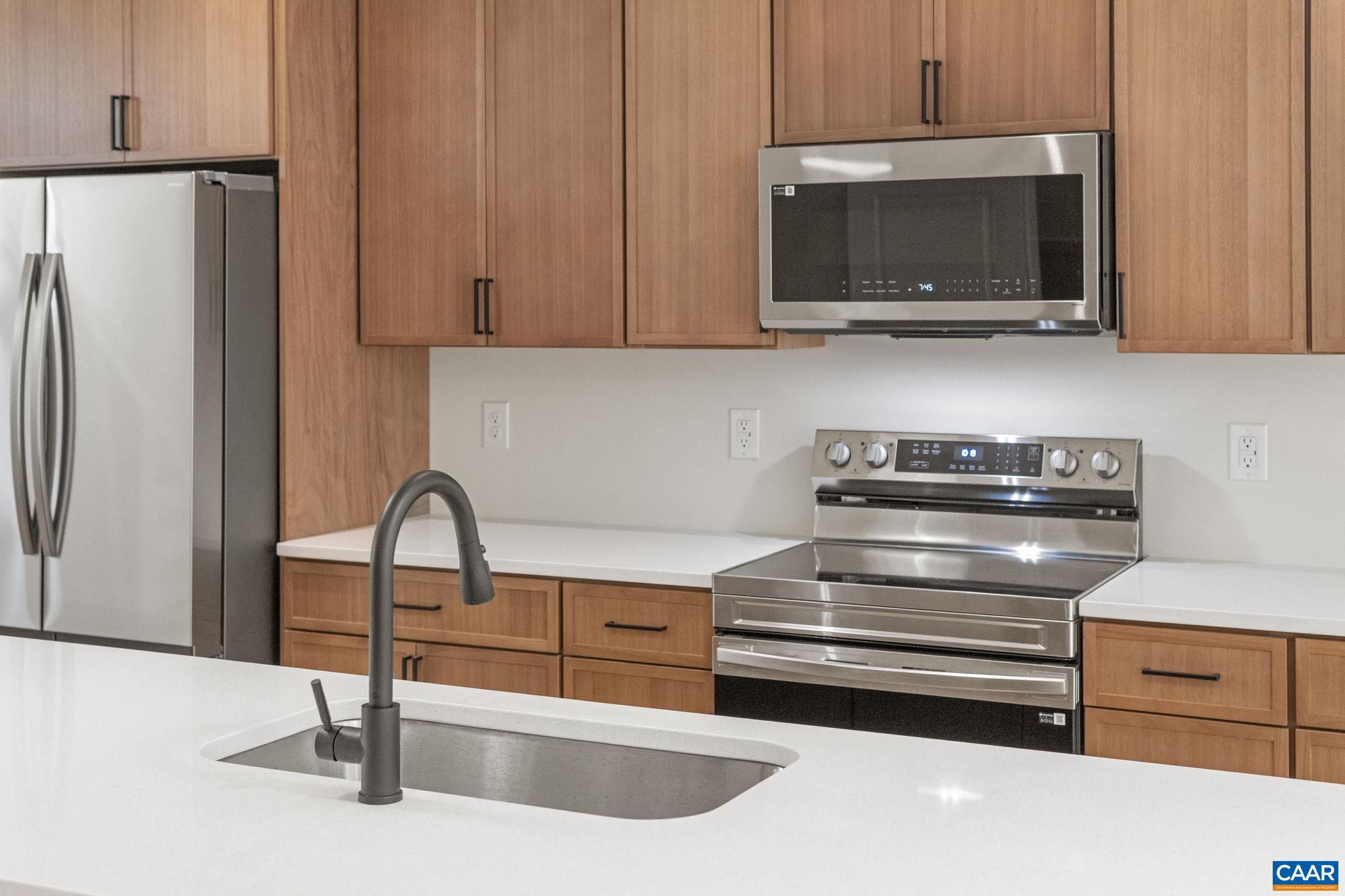 34 Turkeysag Trail Palmyra, VA 22963 - Photo 15 of 55 a kitchen with sink a microwave and refrigerator