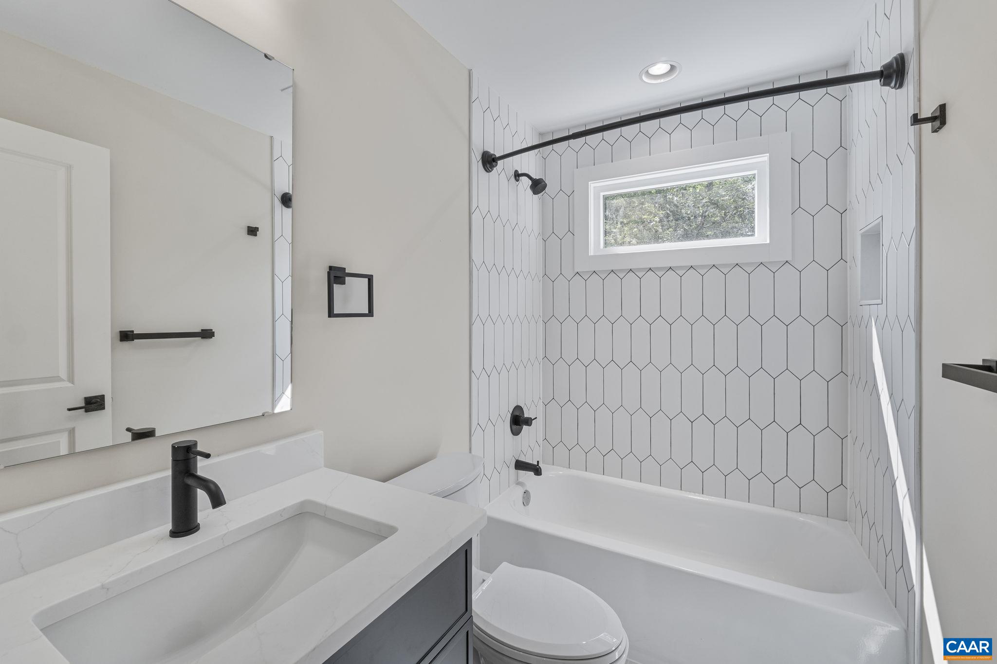 34 Turkeysag Trail Palmyra, VA 22963 - Photo 34 of 55 a bathroom with a granite countertop sink toilet and bathtub