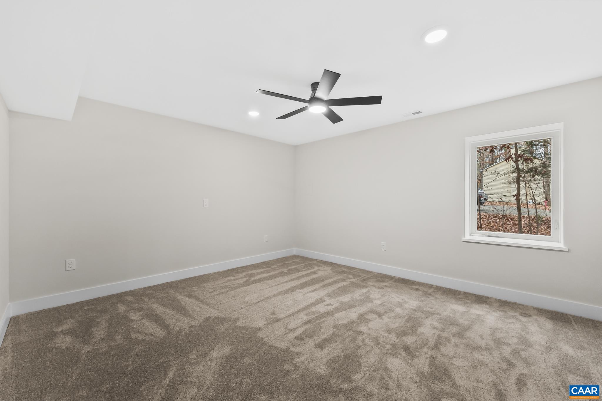 34 Turkeysag Trail Palmyra, VA 22963 - Photo 38 of 55 an empty room with a window and a ceiling fan