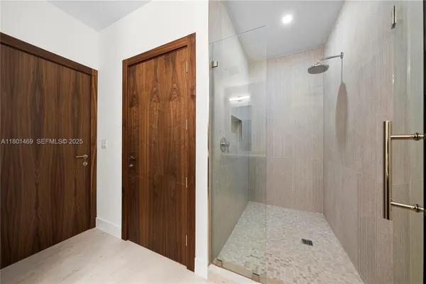 a bathroom with a shower and a sink