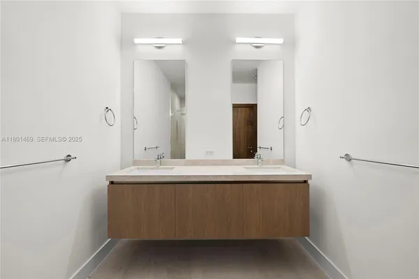 an empty room with windows and tub