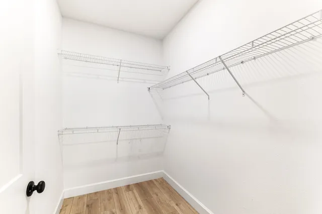 a view of a room with racks on the wall